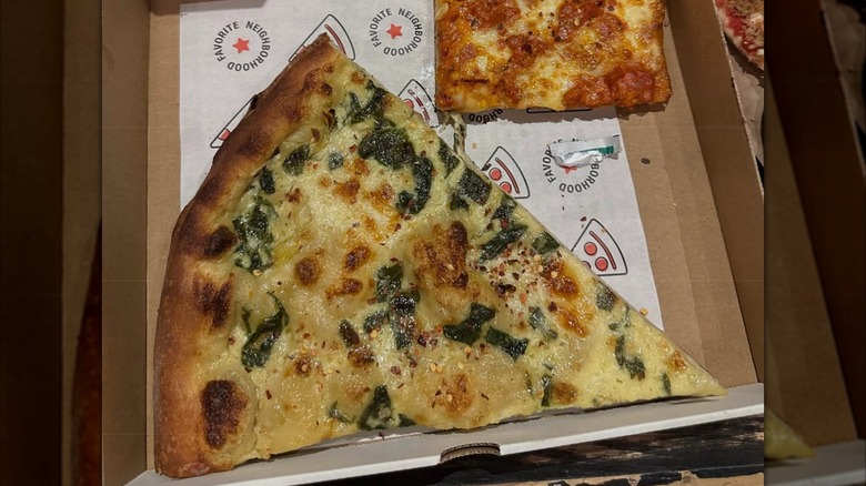 A slice of artichoke pizza from Artichoke Basille's pizza in New York