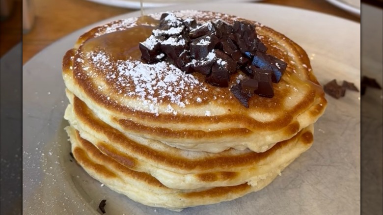 A stack of pancakes with chocolate chips from Clinton St. Baking Co in New York