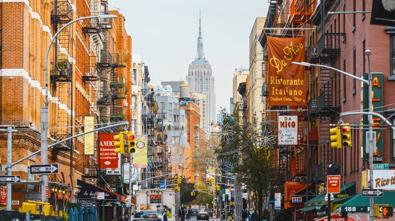 A busy street crowded with restaurants in New York City