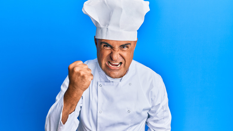 Angry chef shaking fist