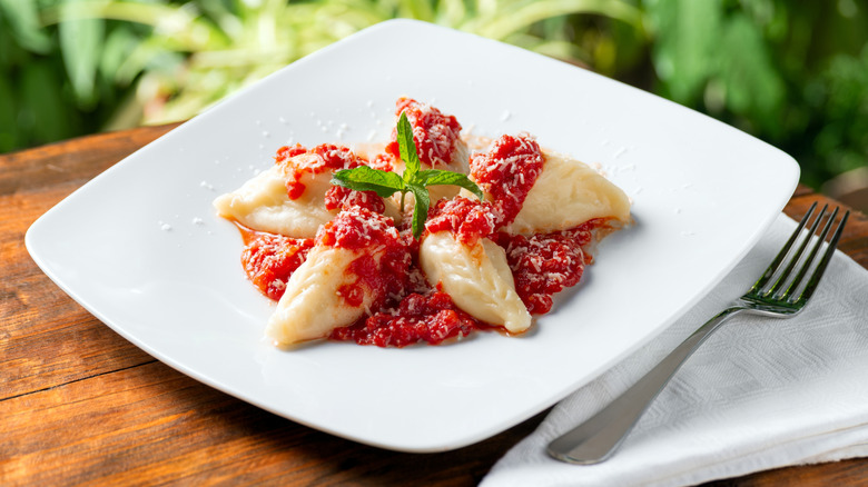 Sardinian culurgione stuffed pasta in tomato sauce