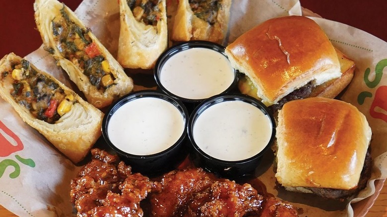 Chili's Triple Dipper with sliders, wings, Southwestern egg rolls, and ranch dressing