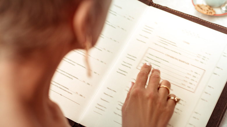 Woman reviewing a restaurant menu