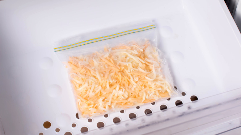 Bag of grated cheese in a freezer drawer