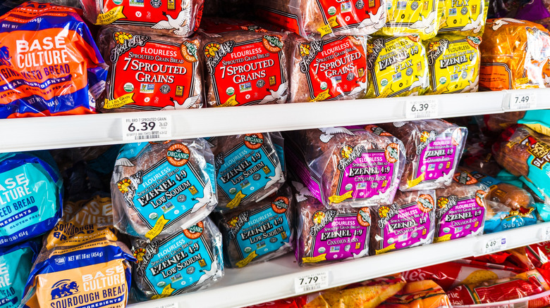 Bags of Food for Life loaves of bread on grocery store shelf