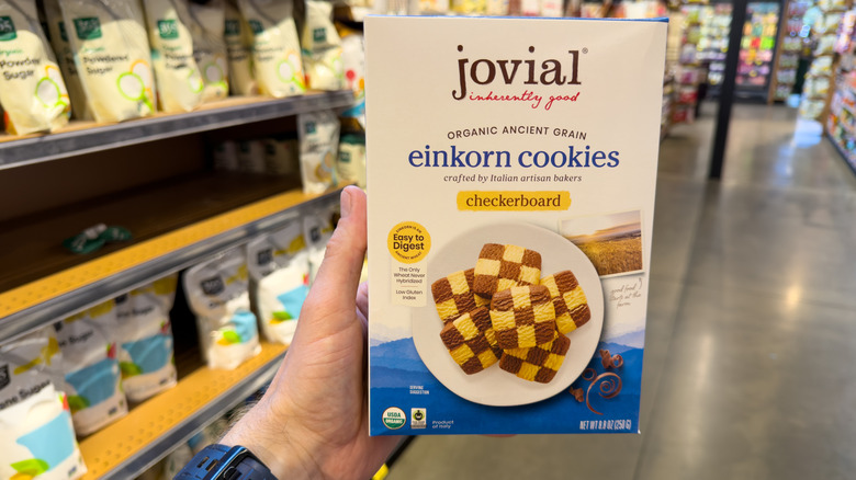Hand holding box of Jovial Organic Einkorn Checkerboard Cookies