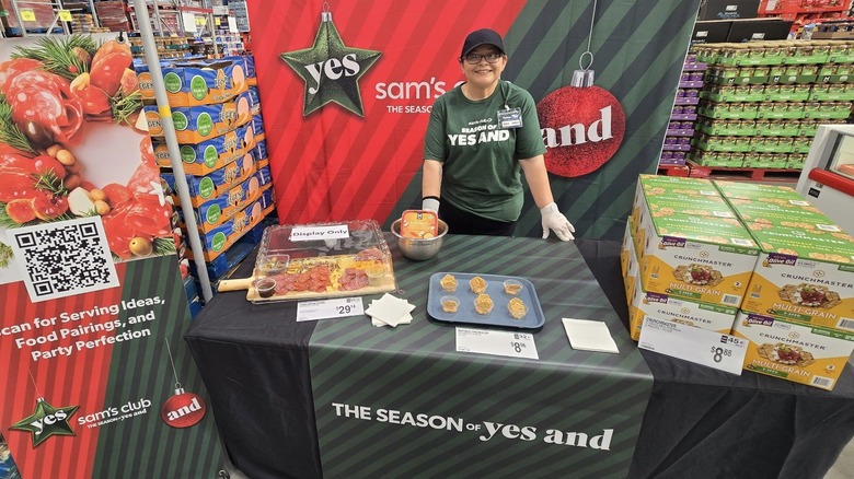 woman handing out samples at the holiday event at Sam's Club