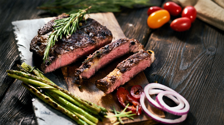 steak, tomatoes, rosemary, and asparagus