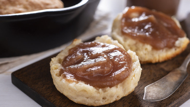 Biscuits with apple butter next to knife