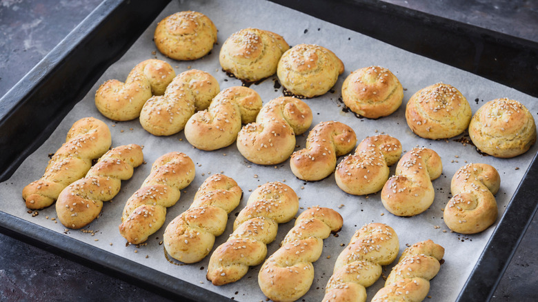 Three shapes of Koulourakia on baking tray
