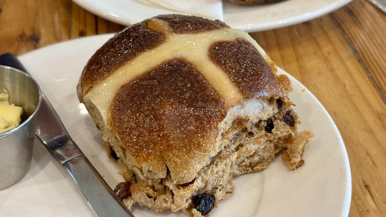 Hot cross bun on a plate