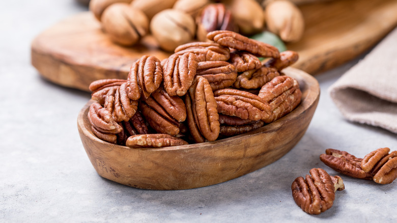 Shelled pecans in wooden bowl