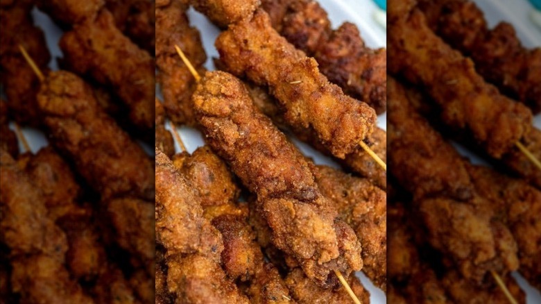 A close-up of a pile of skewers of city chicken in Cleveland