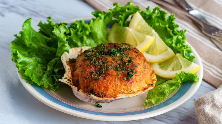 A stuffie on a white plate garnished with lettuce and lemon slices in Providence, RI