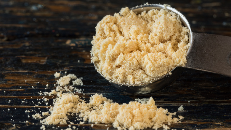 malted milk powder spilled from teaspoon