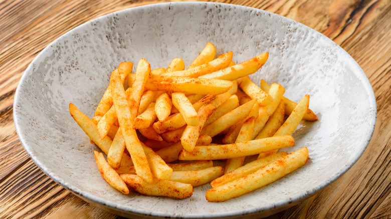 Bowl of seasoned French fries
