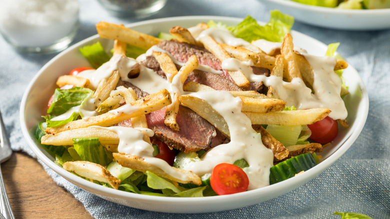 Pittsburgh salad with steak and fries