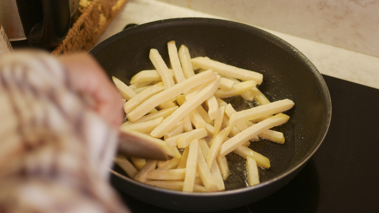 Pan of French fries on the stovetop