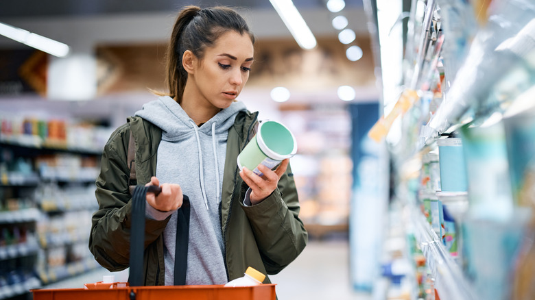 Woman reading food packaging