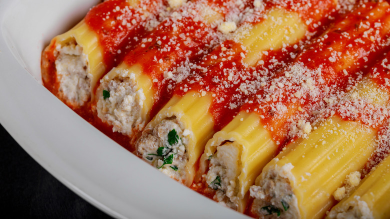 Cheese manicotti with sauce on plate