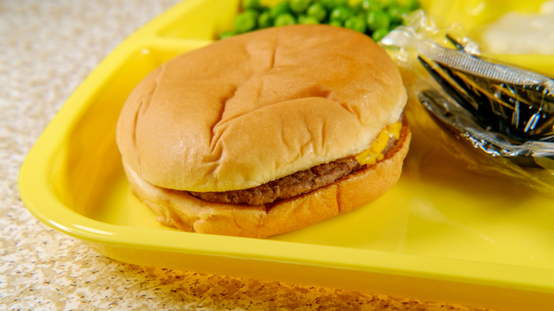 School lunch tray with patty in buns