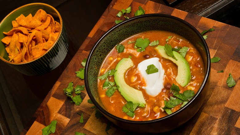 Bowl of tortilla soup with chips