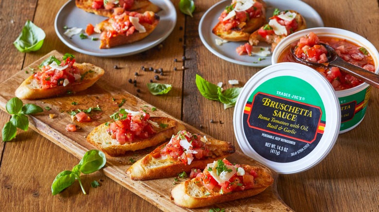 Trader Joe's bruschetta sauce atop crostinis served on a wooden platter