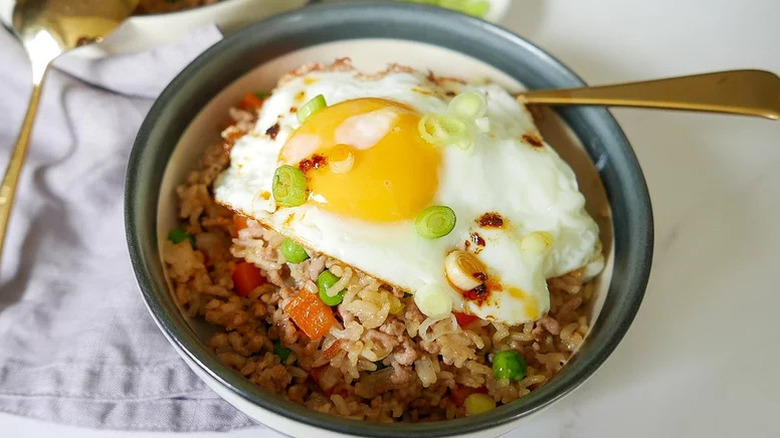 Bowl of fried rice with egg on top
