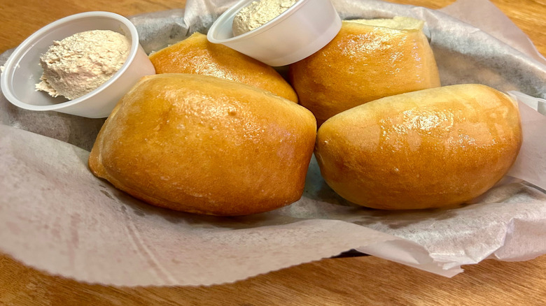 Texas Roadhouse rolls in basket with butter