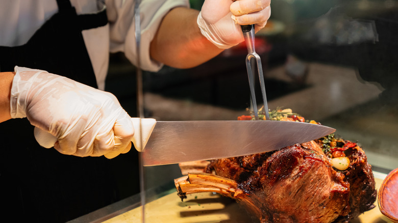 chef cutting prime rib