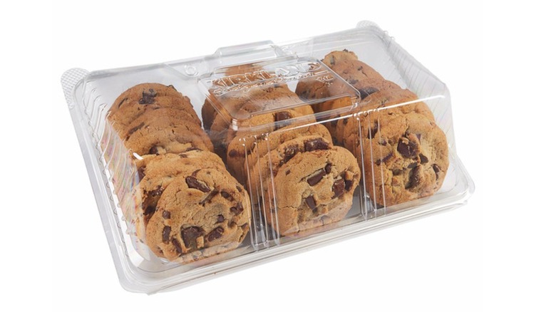 Double chocolate chunk cookies in a plastic clamshell case on a white background