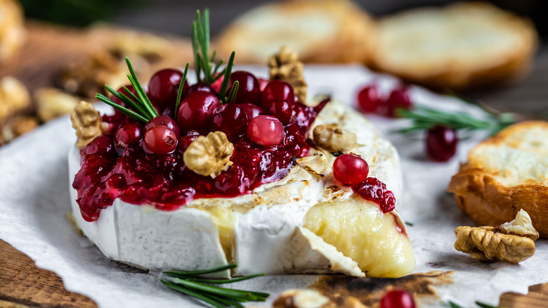 cranberry sauce and walnuts topping brie