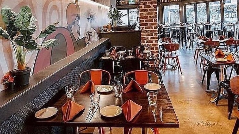 Set dining tables at 2 Fat Indians restaurant