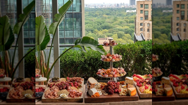 The terrace buffet with platters of cheeses and fruits at Le Jardin Rooftop