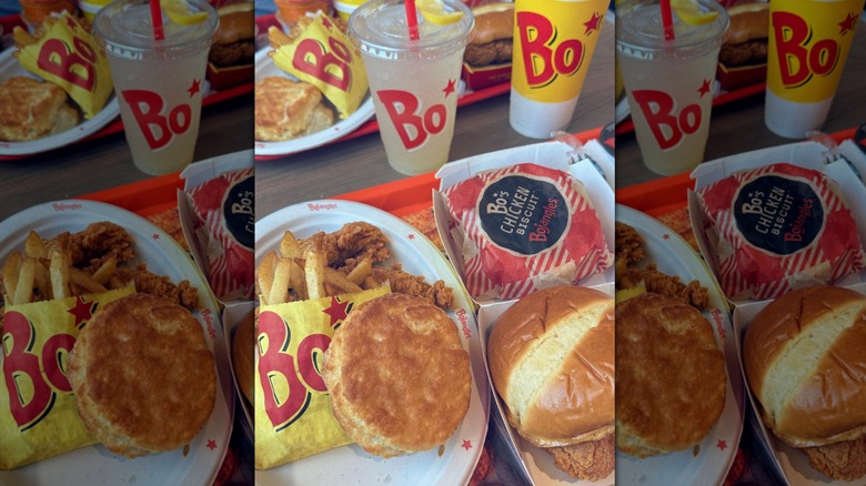 Meal from Bojangles with a biscuit, fries, and sandwich on a red tray
