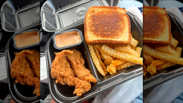 meal from Raising Cane's featuring fried chicken strips, sauce, Texas toast, and french fries