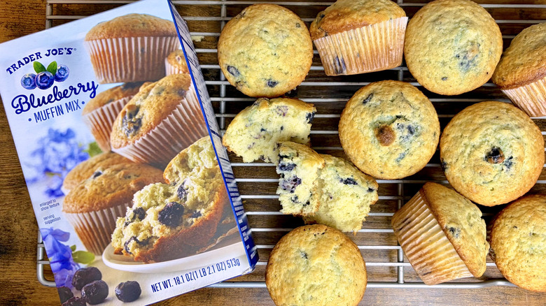 A box of Trader Joe's Blueberry muffin mix and baked muffins