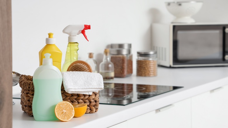 cleaning supplies on kitchen counter