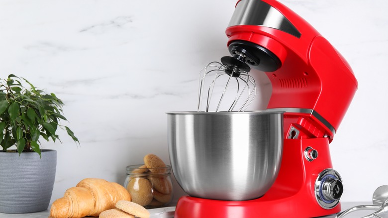 red stand mixer on kitchen counter