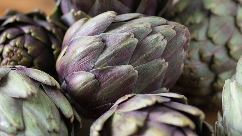 pile of raw artichokes