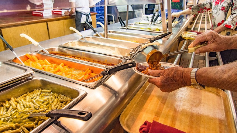 Patrons dishing out food at Underwood's Cafeteria