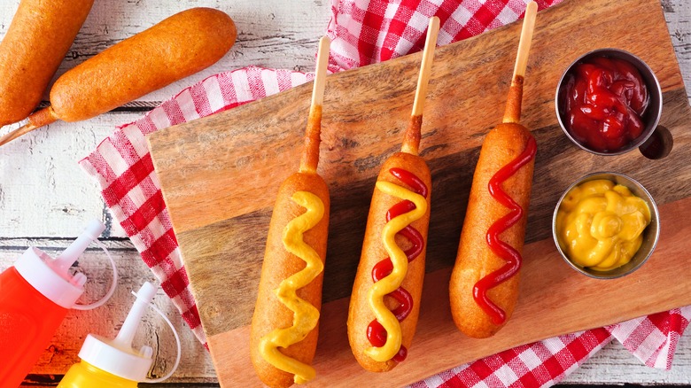 corn dogs with ketchup and mustard