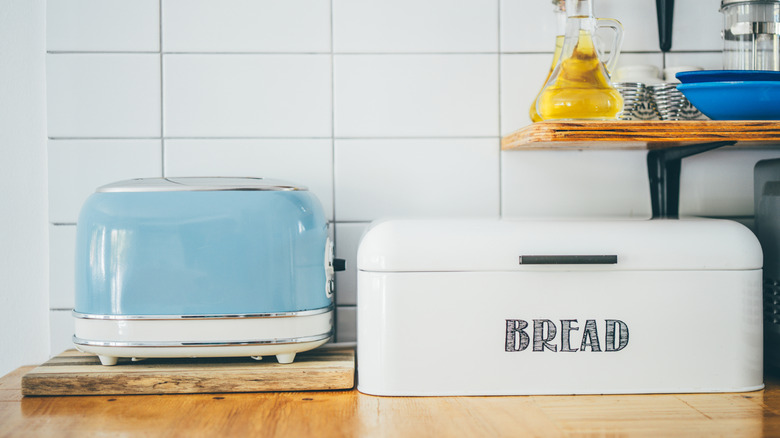 retro-inspired white bread bin and powder blue bread toaster