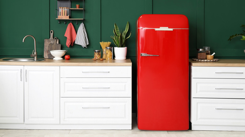 Red vintage refrigerator in a kitchen