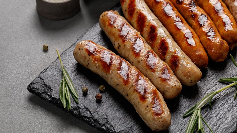 grilled sausages on slate board