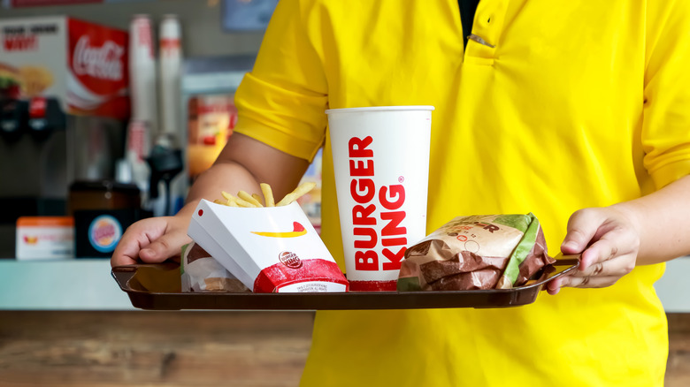 Person holding Burger King tray