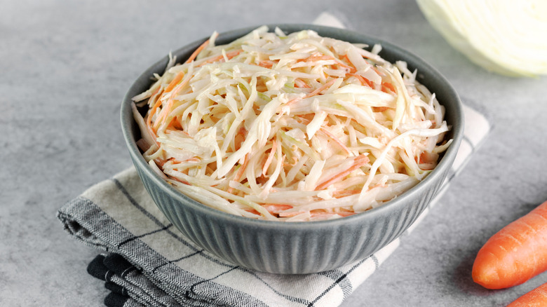 A bowl of coleslaw on a gray countertop