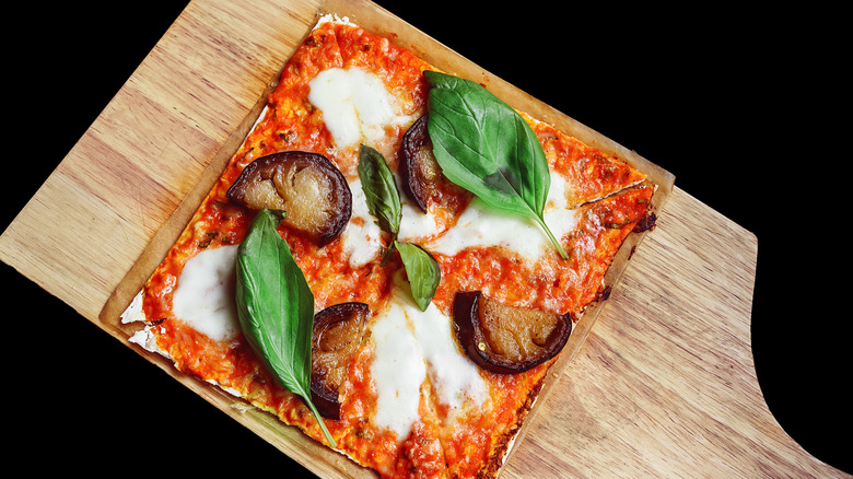 Matzo pizza on a wooden board