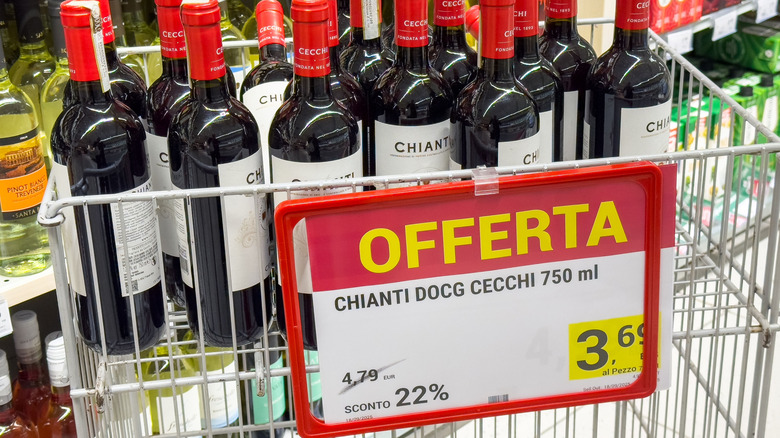 Bottles of wine in a cart that are onsale