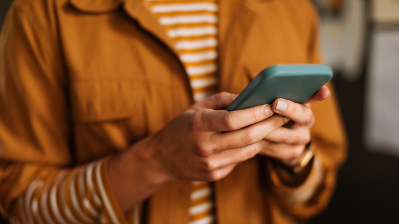 Person holding a cell phone